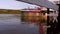 Drowned landing stage on the river. Half gone under water