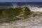 Drowning man trying to swim out of the ocean filtered