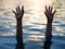 Drowning victims, Hand of drowning man needing help.