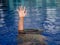 Drowning victims, Hand of drowning man needing help.