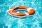 Drowning in water catch lifebuoy. Safety and urgent help. Resque needed. Life buoy floating in pool.