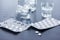 Drug abuse: Close up of pills and alcohol on a grey table