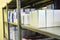 Drug boxes in a shelf in a pharmacy. Store of medicines and vitamins. Background for sale in a pharmacy and health lifestyle.