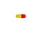 Drug. Capsule, tablet of red and yellow color isolated on a white background. Medicine, pharmaceutical