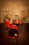 Drum set red painted in lacquer, on the background of the wall vintage style on the wooden floor