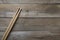 Drum stick on wooden table background, top view, music concept