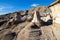 Drumheller Hoodoos, Alberta Canada - September 23, 2021: Tourists walking the stairs around the Hoodoos on a sunny day in