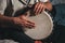 The drummer plays the ethnic percussion musical instrument djembe