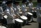 Drummers in white colonial uniforms march