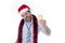 Drunk businessman drinking champagne wearing santa hat at office christmas party