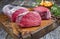 Dry aged beef filet steak natural with chanterelles on a wooden cutting board