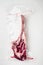 Dry aged raw tomahawk beef steak in plastic airtight pack, on white stone  background, top view flat lay