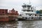 Dry barge floats on a river in the Moscow Region