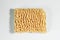 Dry briquette of instant noodles on a light background