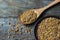 Dry bulgur wheat grains in wooden scoop or shovel, rustic style