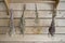 Dry bundles of medicinal plants hanging on the wall of the boards. Background, blurred