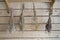 Dry bundles of medicinal plants hanging on the wall of the boards. Background, blurred