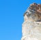 and dry bush rock alone in the sky santorini europe greece