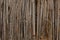 Dry cane and clay texture of a mud hut of a structure brown close up