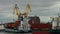 A Dry Cargo Ship Being Loaded In Port