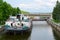 Dry cargo ship in ship lock of Uglich hydroelectric power