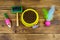 Dry cat food in bowl, cat toys and pet slicker brush on wooden background. Top view. Pet care concept