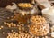 Dry chickpeas close-up in a glass jar. Aquafaba and whipped mousse. On a natural wood gray background, horizontally