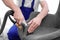 Dry cleaning worker removing dirt from armchair