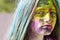Dry color on face. Colorful holi on painted hair and face. Girls with colorful hair and face enjoing in the moment. Dry