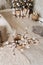 Dry Cotton Sticks in Wicked Basket on Wooden Floor