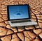 Dry Cracked Earth & Pure Water on Laptop Screen