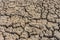 Dry cracked soil of levee of salt evaporation pond