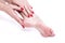 Dry dehydrated skin on the heels of female feet with calluses