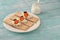 Dry diet crisp breads with cheese, cherry tomatoes and olives