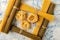 Dry fettuccine pasta in a frame of spaghetti bunches on a softly blurred textured white and blue background