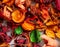 Dry flowers and leaves of orange and green color close-up on a white background.