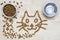 Dry food for cats. Two bowls. Wooden surface. Cat shape