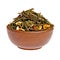 Dry fruit green tea in a clay cup