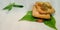 dry fruits mixture branded biscuits isolated on green leaves with white background