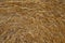 Dry golden straw bale texture or background