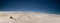 Dry grass on the slope of a wandering dune