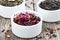 Dry herbal teas in white bowls
