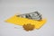 Dry leaf. banknotes in a yellow envelope. open envelope with banknotes on a light background. envelope with banknotes