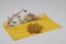 Dry leaf. banknotes in a yellow envelope. open envelope with banknotes on a light background. envelope with banknotes