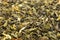 Dry leaves of green tea background texture, heap of dried leaves Chinese green teas with primiems