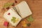 Dry leaves and old book on wooden background. Autumn romance. The book of romantic tales.