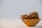 Dry leaves, pears, and porcupine in bowl