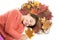 Dry maple leaves in hairstyle. Fall season concept. Hair care in autumn. Prevent dry split hair ends. Child enjoy fall