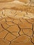 Dry mud cracked pattern on desert ground , natural texture of Earth