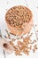 Dry Organic Brown Lentils against a wooden background